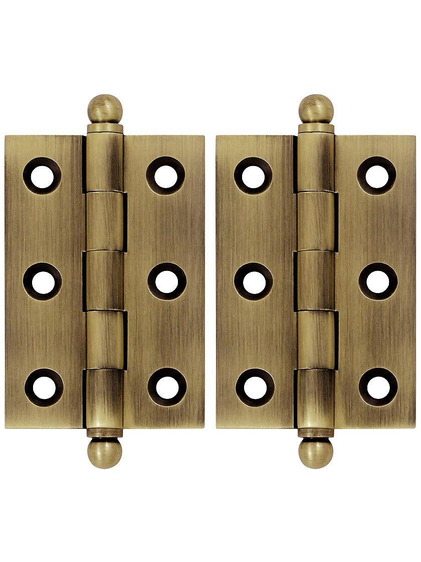 Pair of 2 1/2 inch x 1 11/16 inch Cabinet Hinges in Antique Brass.